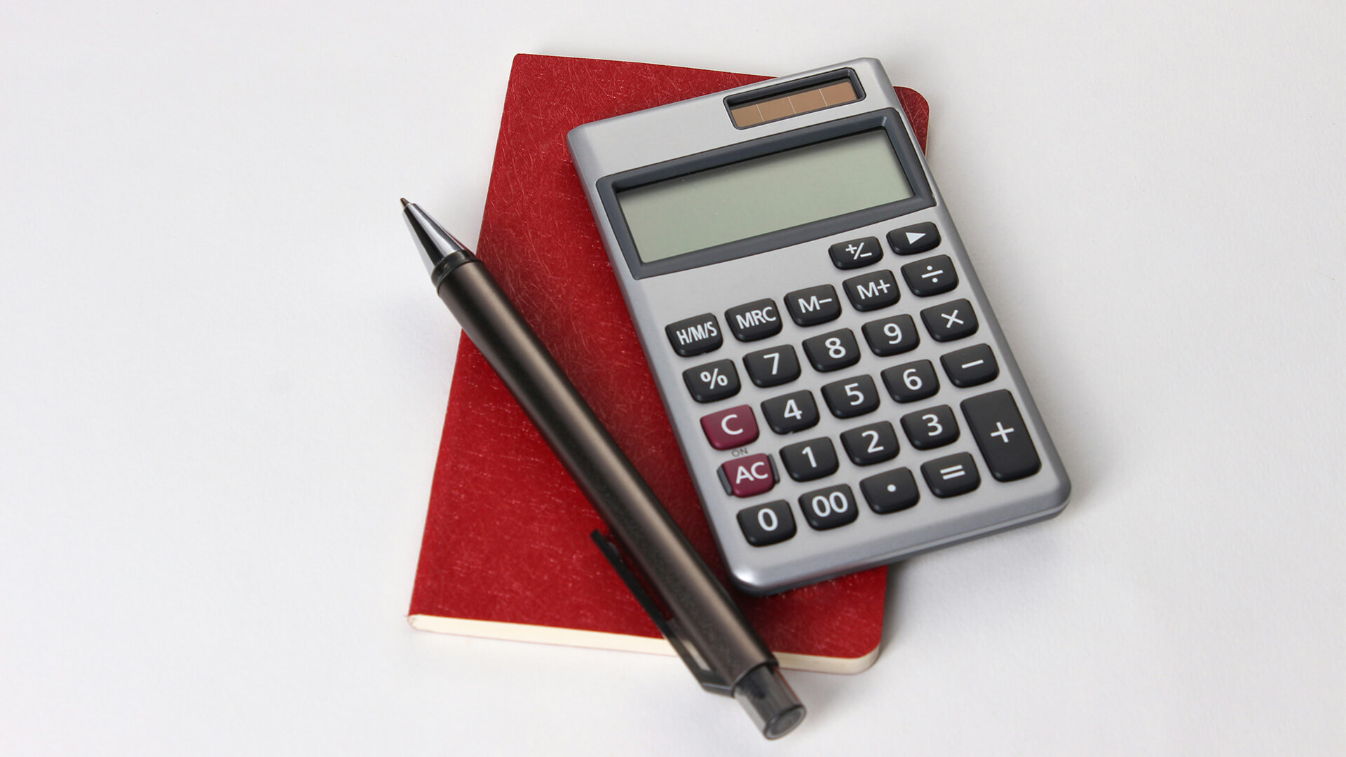 Mathes textbook open on a section about angles and calculator.