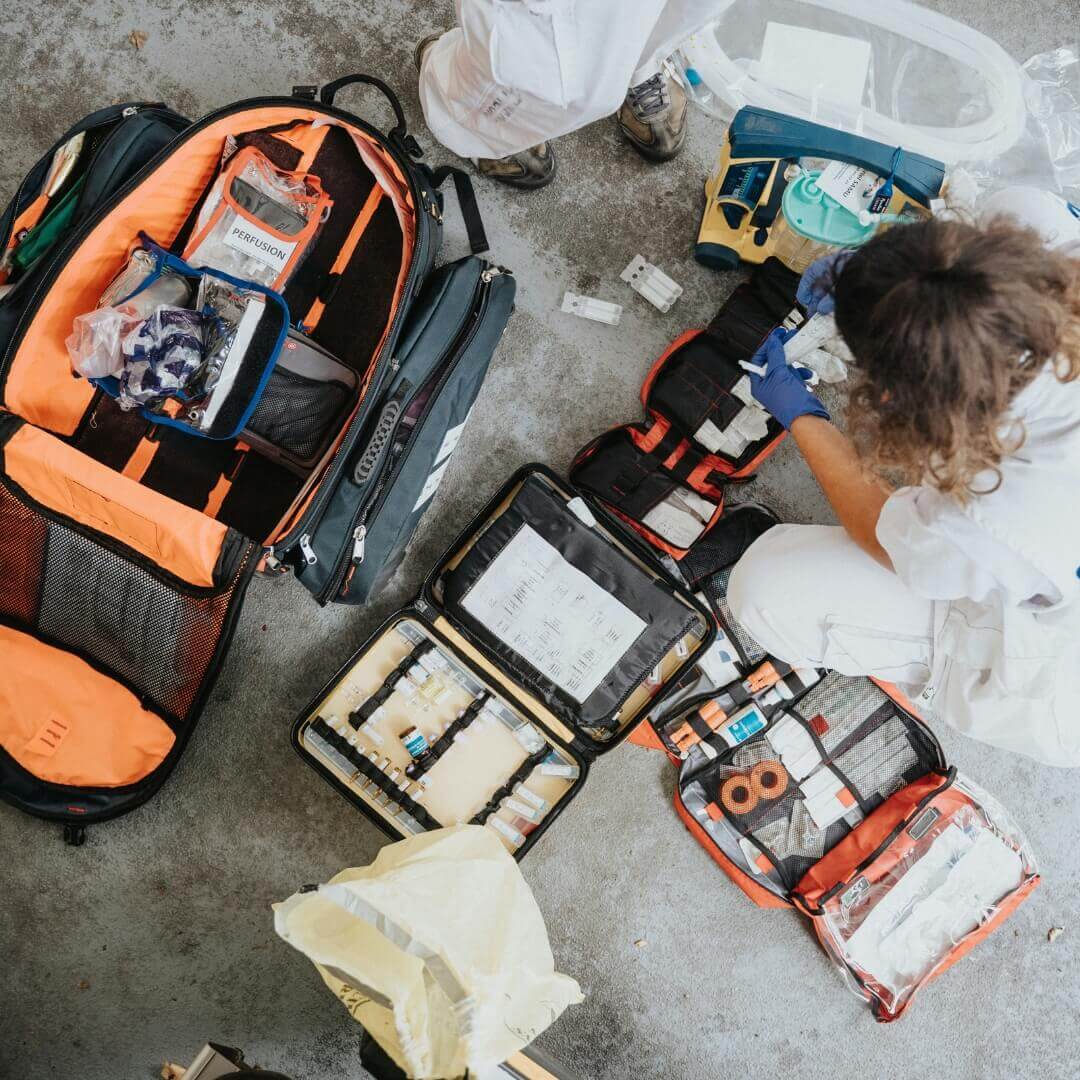 Paramedic sorting through kit.