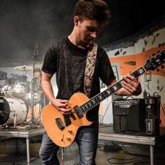 Student playing guitar